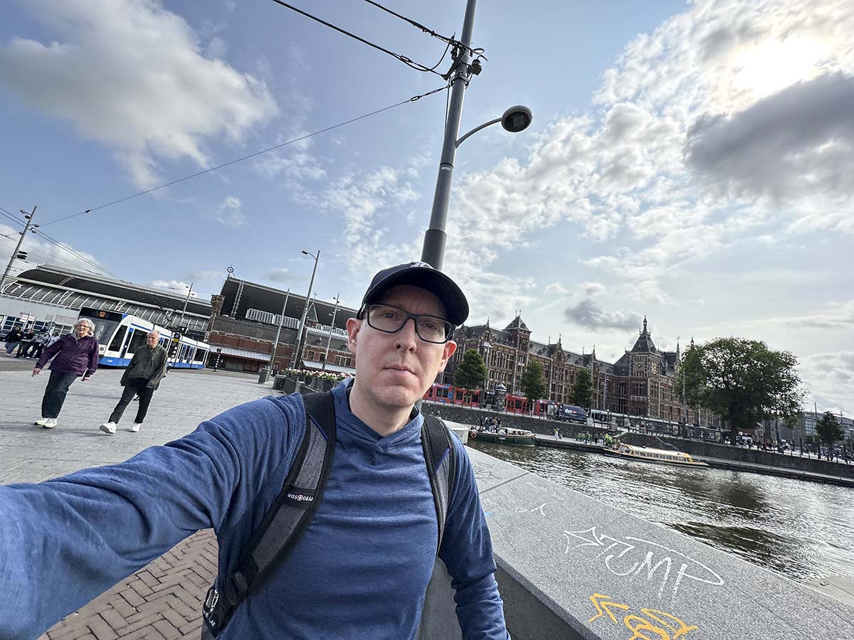 Scott walking out of the central train station in Amsterdam