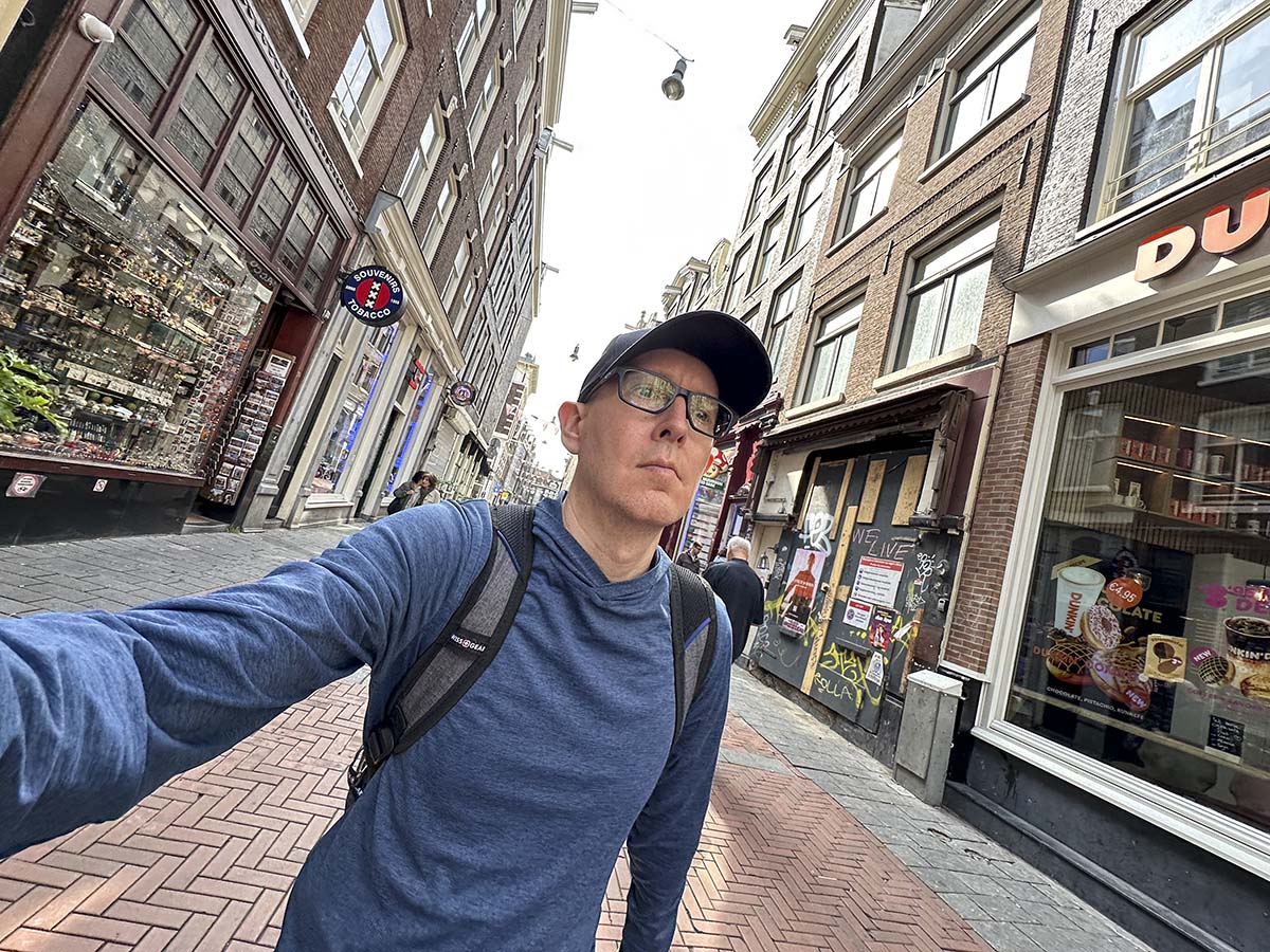 Scott Leazenby walking through Central Amsterdam